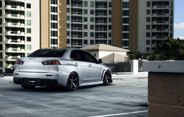 Picture the building, silver, Mitsubishi, Lancer, Evolution, skyscraper, Lancer, Mitsubishi, silvery, evolution