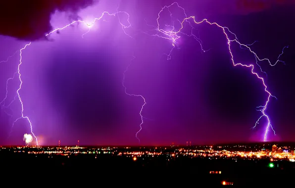 Picture lightning, night city, lilac sky