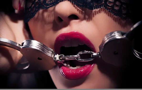 Picture lips, teeth, metal handcuffs
