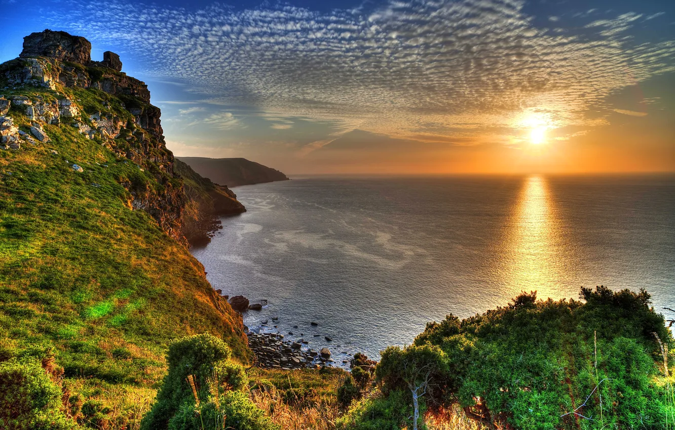 Photo wallpaper sea, the sky, the sun, rays, sunset, stones, rocks, coast, England, beauty, horizon, Exmoor National …